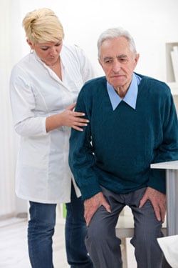 unhappy older man with nurse