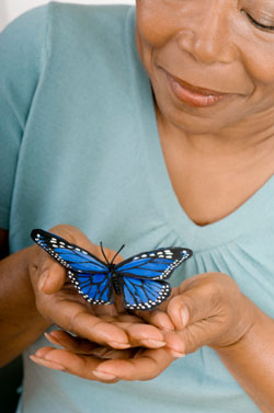 senior holding butterfly