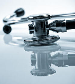 stethoscope on a reflective surface