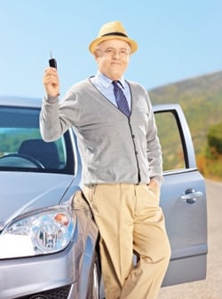 senior man with his new car