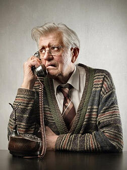Senior man on landline