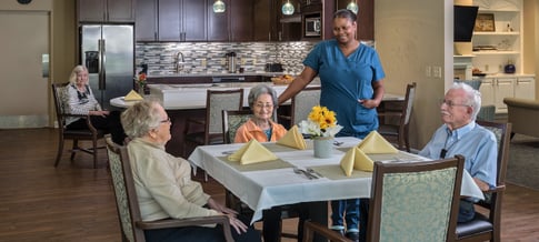ECH residents enjoy a meal together.