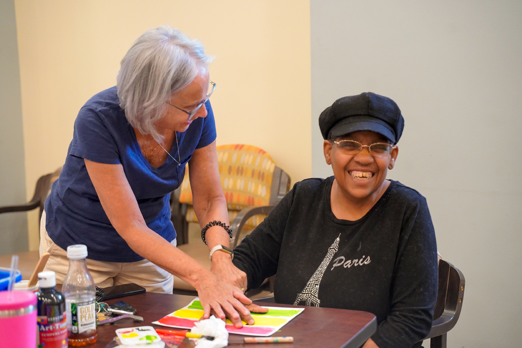 An ERS affordable living resident and staff member paint to commemorate Juneteenth.