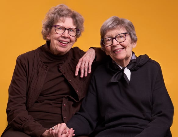 Glenna and Shirley Holding Hands